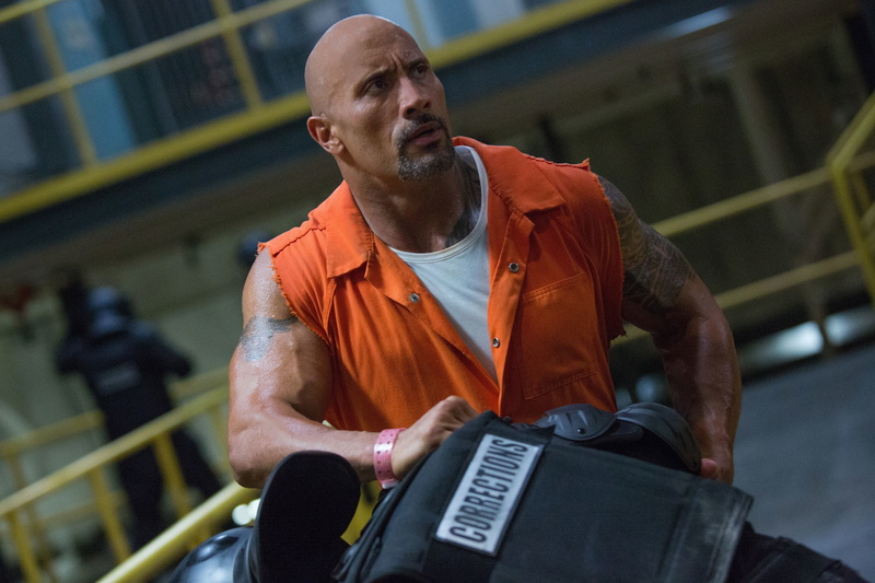 orange color, focus on foreground, lifestyles, dwayne, casual clothing, leisure activity, one person, johnson, adult, sports training, bald, rock, fast