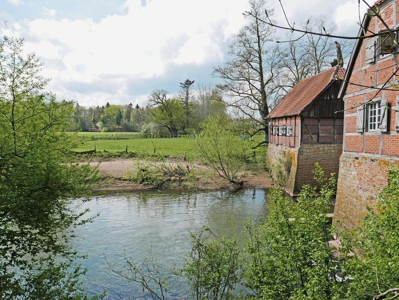 water mill, old mill, built structure, river, reflection, truss, cloud - sky, building, beauty in nature, day, outdoors, nature, flat land, building exterior