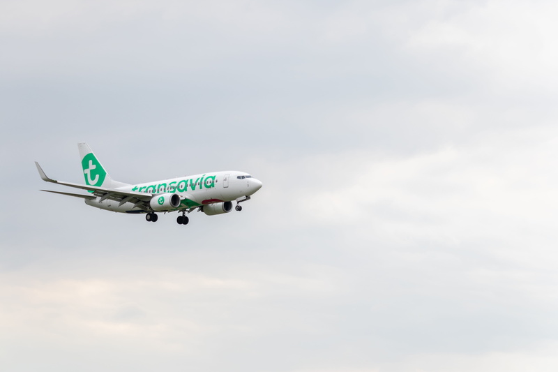 boeing, transavia, rotterdam the hague airport, mid-air, flying, transportation, side view, motion, air vehicle, mode of transportation, aerospace industry