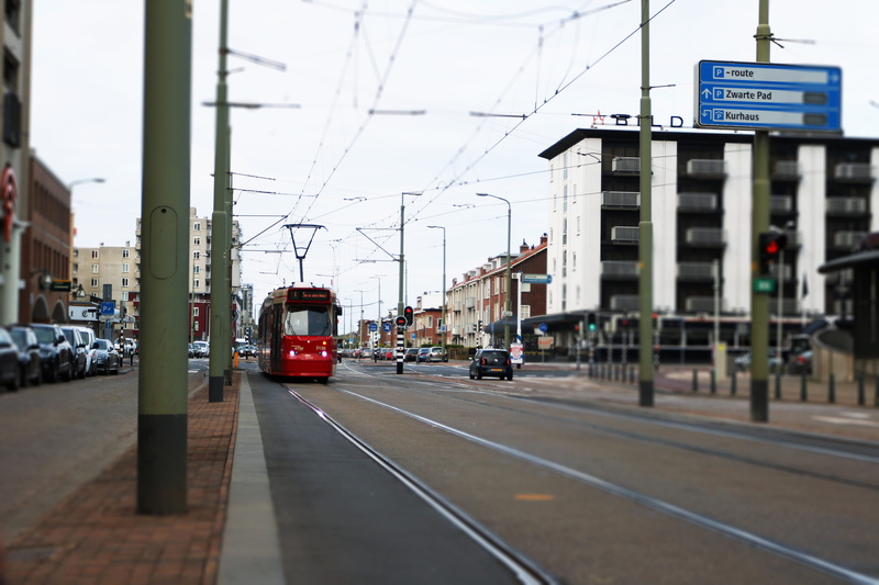 cable, city, land vehicle, low-angle, public, electricity, 5K, street, building exterior, railroad track, rail transportation, city street, architecture