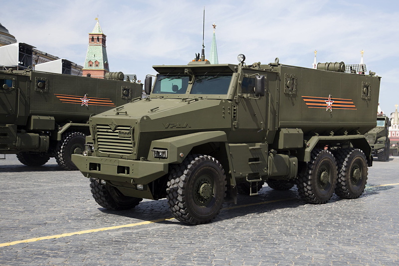 armored car, armored, government, machinery, truck, street, weapon, road, gun, car, no people, sunlight, victory day, camouflage, city, transportation