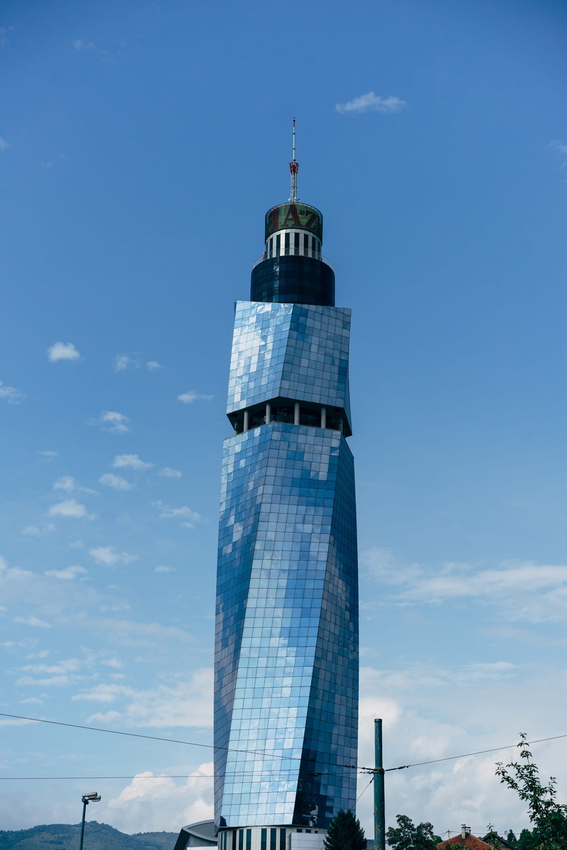 no people, tower, outdoors, architecture, yugoslavia, avaz twist tower, bosnia, sarajevo, lighthouse, blue, sky, direction, office building exterior, guidance