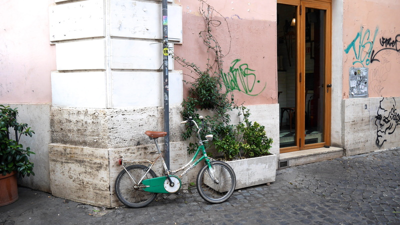 day, machine, door, entrance, cobblestone, land vehicle, jar, parking, vase, sidewalk, outdoors, built structure, potted plant, pottery, wall, transportation