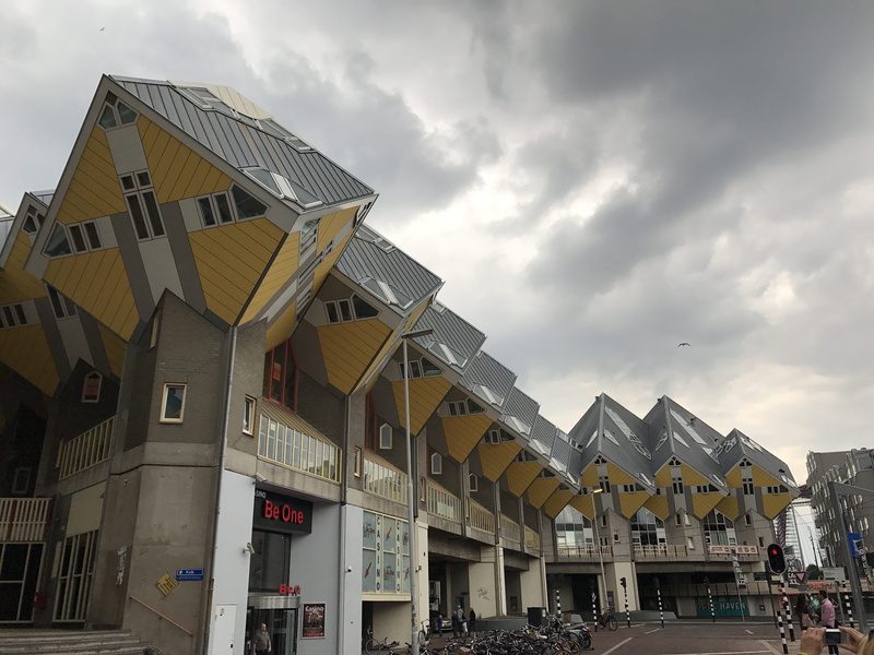 group of people, sky, residential district, building, cloud - sky, outdoors, nature, built structure, day, cube, low angle view, incidental people, netherlands