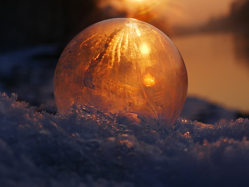 snow, sphere, selective focus, nature, frost blister, winter, outdoors, illuminated, sky, ball, environment, land, glass - material, planet - space, ice