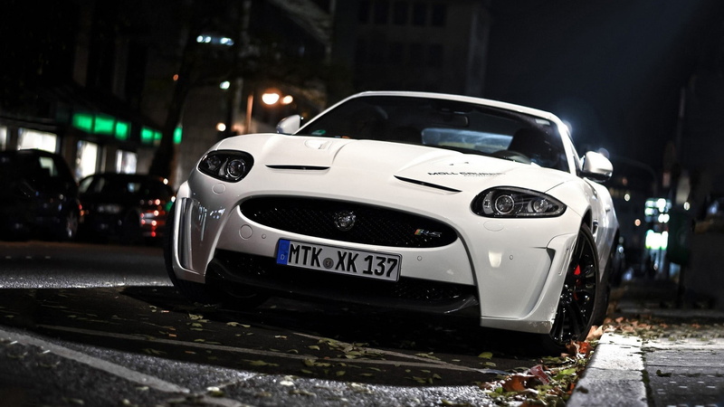city, car, no people, road, text, city street, wet, vehicle, architecture, motor vehicle, mode of transportation, night, Jaguar, transportation, close-up