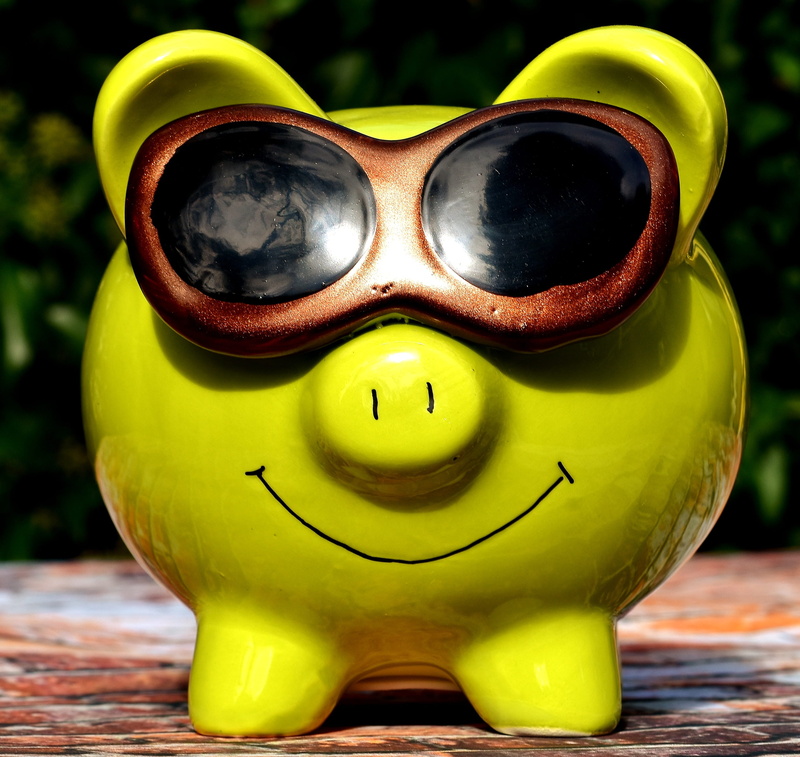 representation, human representation, yellow, glasses, anthropomorphic face, face, piglet, piggy bank, single object, figure, close-up, table, ceramic