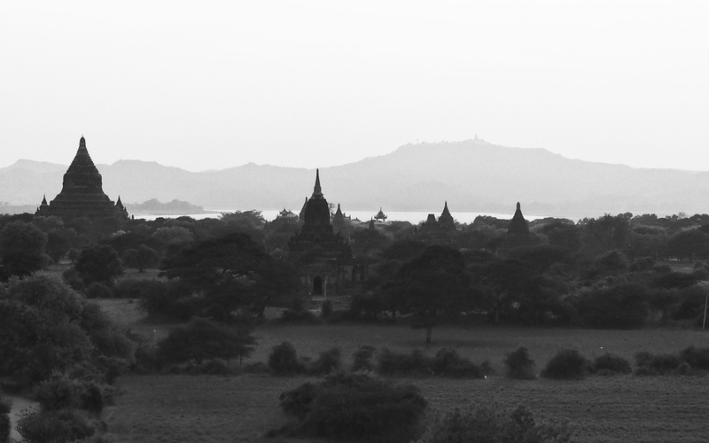 outdoors, ancient civilization, vast, old bagan, grey, sky, the past, religion, mountains, travel destinations, landscape, monochrome, building, belief