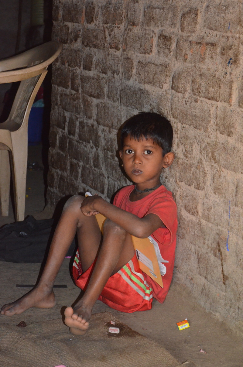 wall - building feature, brick, lifestyles, boy, indian, 4K, people, one person, child, casual clothing, real people, sitting, african Descent, children