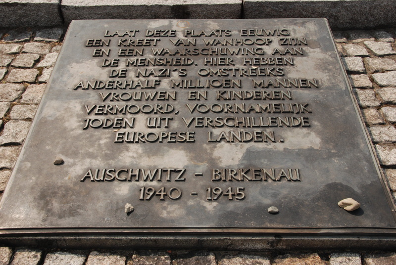 tombstone, information sign, information, day, poland, sign, communication, non-western script, grave, stone, high angle view, history, outdoors, western script