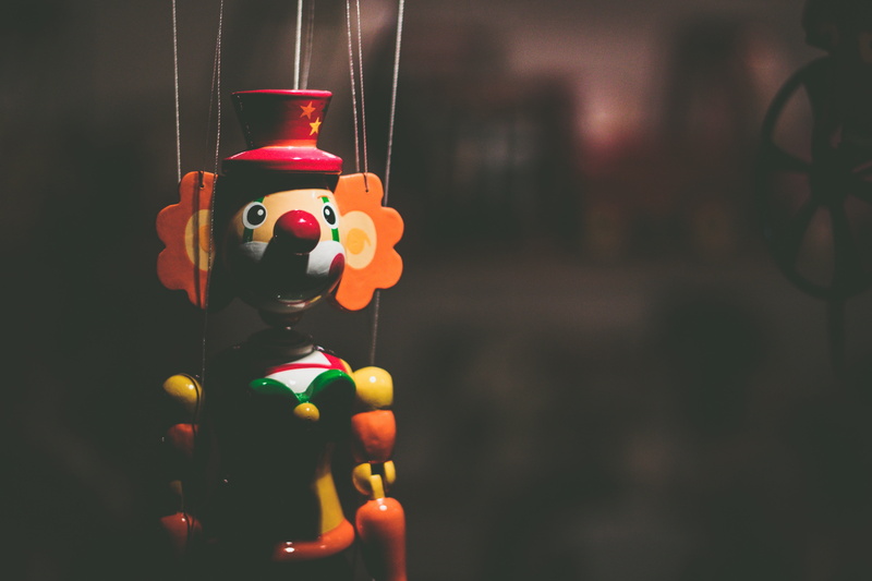 male likeness, toy, close-up, plastic, art and craft, figurine, focus on foreground, representation, hanging, man made, clown, multi colored, 4K, no people