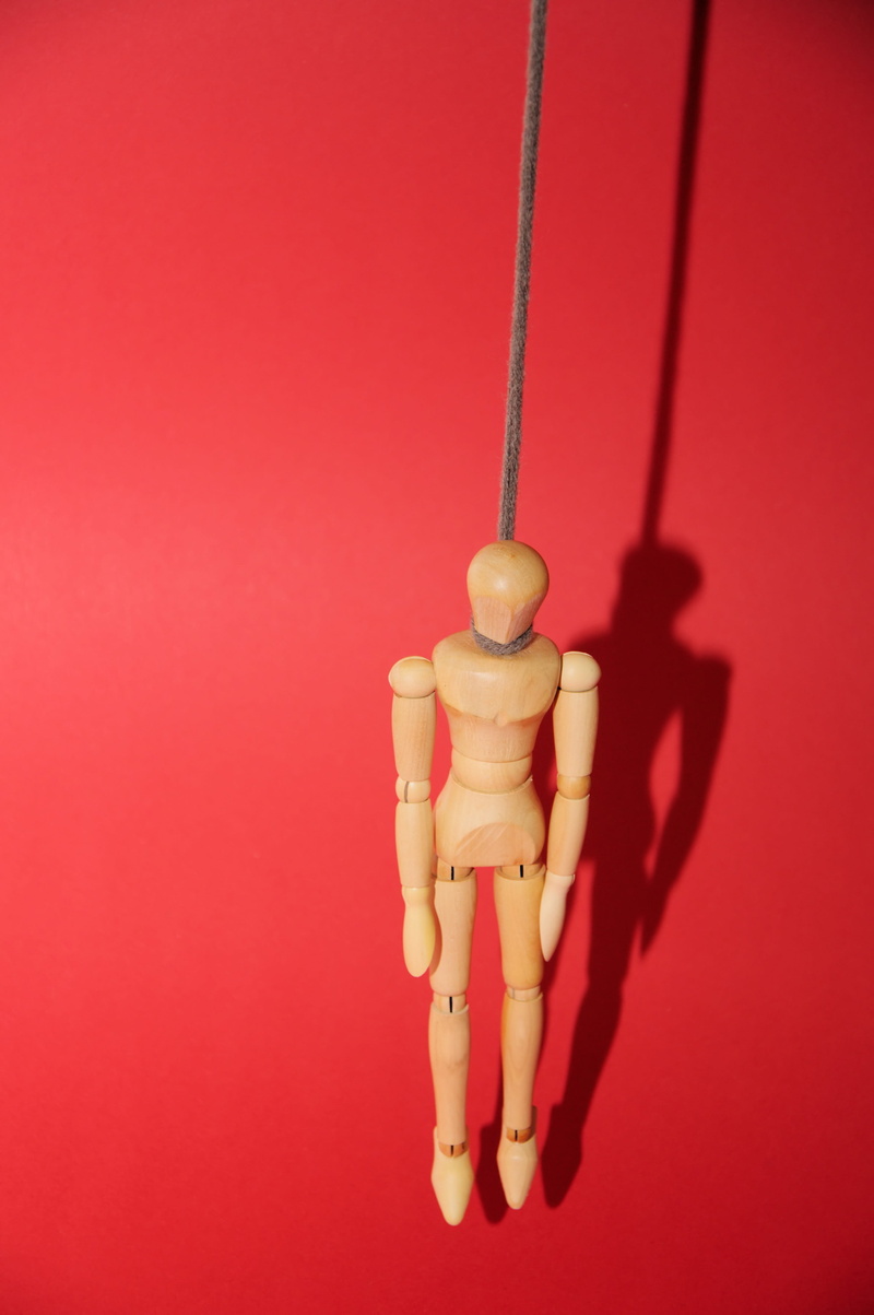 indoors, suicide, adult, hand, die, colored background, doll, studio shot, death, dead, rope, human body part, love, figure, wooden, hanging, red background
