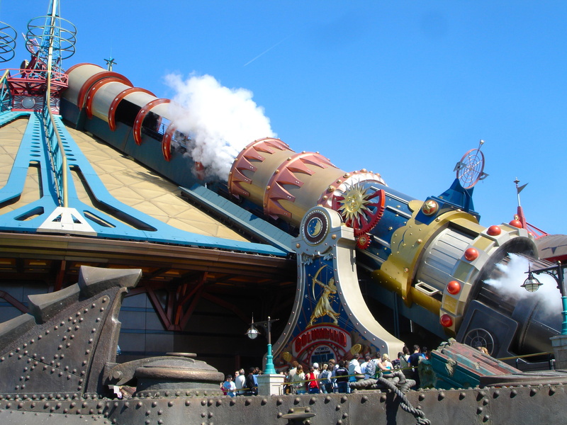 blue, sky, transportation, low angle view, space mountain, crowd, outdoors, paris, amusement park ride, nature, theme, incidental people, day, air vehicle