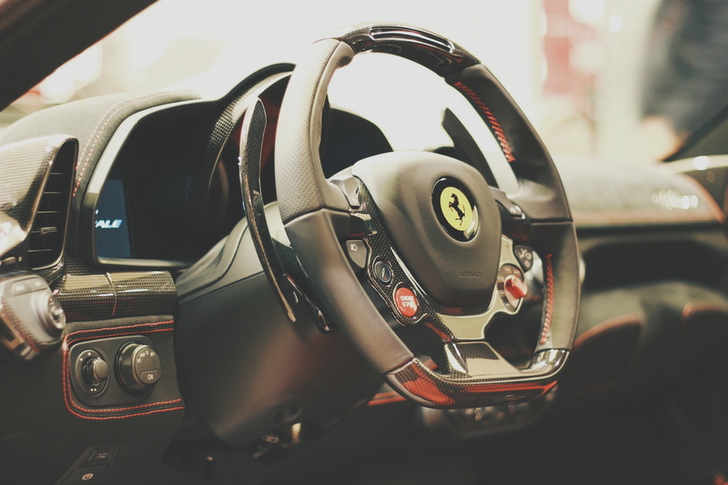 land vehicle, day, Ferrari, close-up, outdoors, 1080P, technology, car, steering wheel, vintage car, stationary, gray, wheel, vehicle interior, mode of transportation
