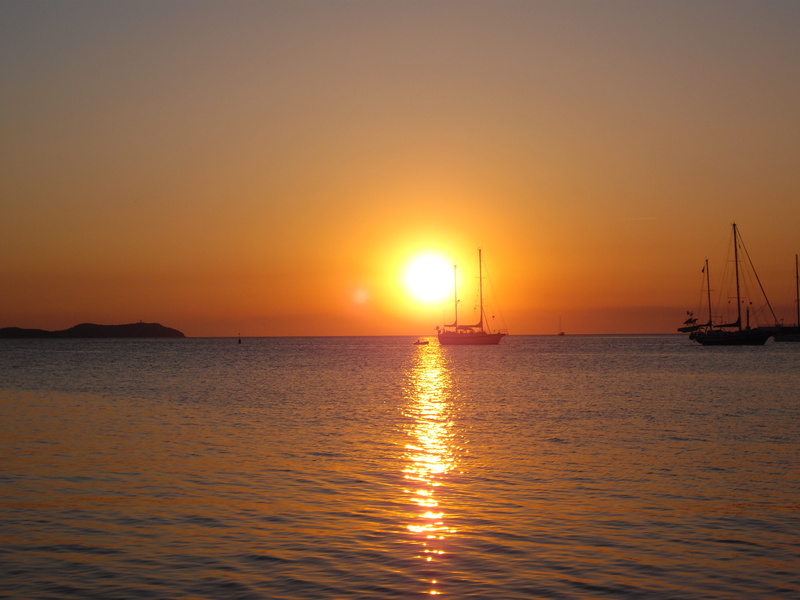 no people, seascape, horizon over water, sun, transportation, tranquility, ibiza, sunlight, sky, water, café del mar, lens flare, nautical vessel, orange color