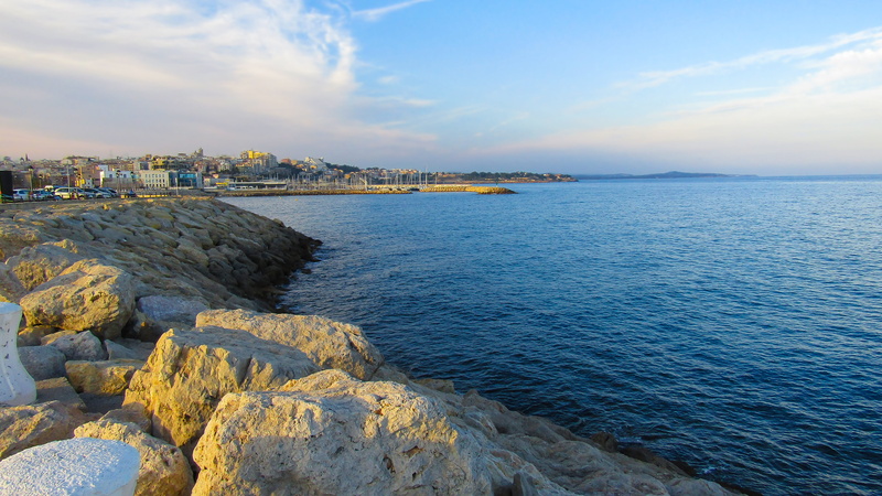 bay, building exterior, sea, built structure, tranquility, tranquil scene, no people, landscape, rock - object, rock, architecture, sky, cloud - sky, city