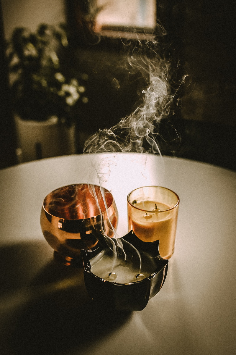 candle, halloween, alcohol, helmet, freshness, close-up, indoors, tea, hot drink, no people, autumn, beverage, glass, refreshment, cup, fall, apparel, coffee - drink