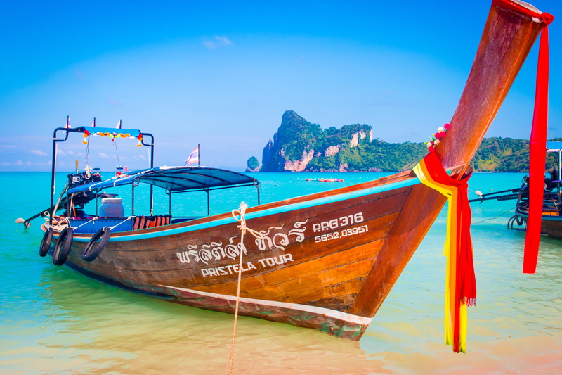 outdoors, phi phi islands, longtail boat, no people, mode of transportation, sky, tranquility, blue, text, moored, communication, scenics - nature, sea