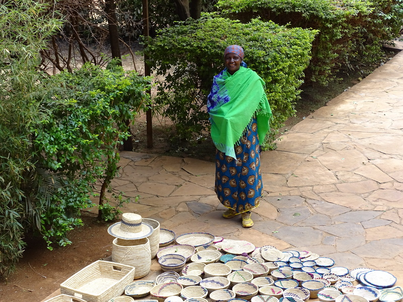 females, paving stone, africa, plant, 5K, full length, maasai, one person, day, seller, leisure activity, wiman, green color, senior adult, tree, footpath