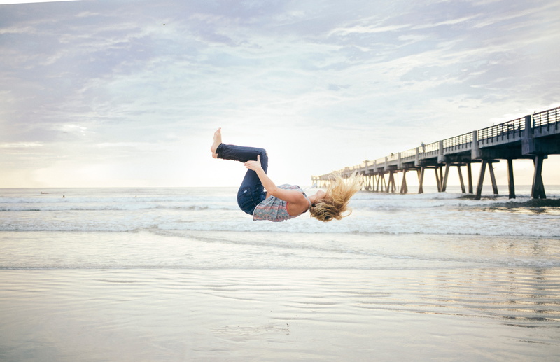 shore, young adult, women, sky, lifestyles, horizon over water, bridge, people, scenics - nature, cloud - sky, beach, full length, tumbling, motion, land