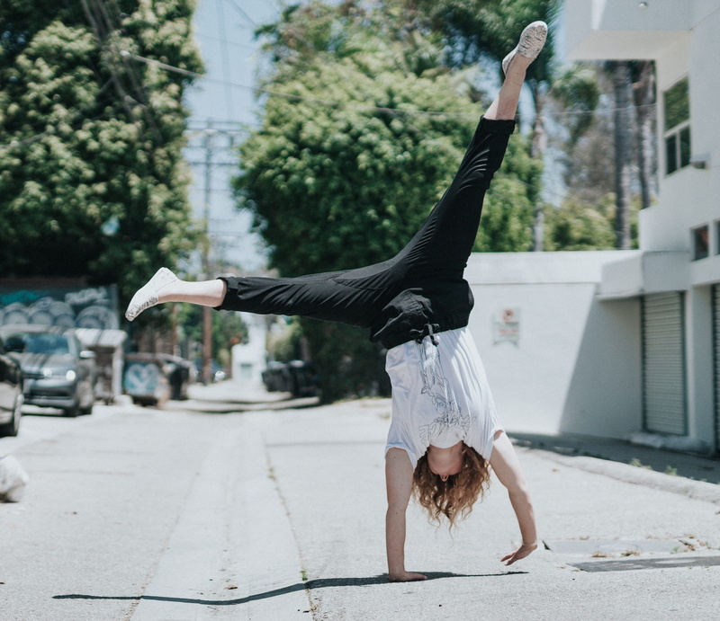 2K, handstand, vitality, road, city, woman, skill, daytime, person, human arm, dancing, real people, full length, move, building exterior, architecture