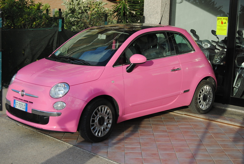 outdoors, Car, land vehicle, building exterior, 2K, pink color, Sardinia, day, architecture, tree, stationary, travel, Pink, no people, built structure