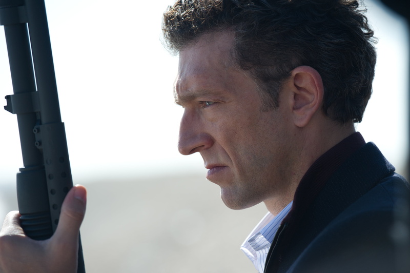 portrait, adult, coat, contemplation, lifestyles, mid adult, close-up, looking away, weapons, frame, black, Vincent Cassel, outdoors, day, one person, focus on foreground