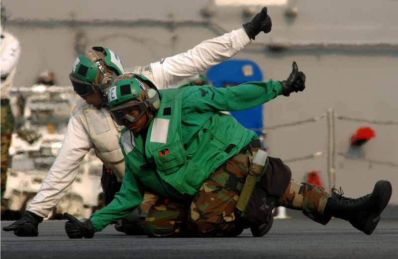 security, leisure activity, Clear, flight, lifestyles, people, crouching, aircraft carrier crew, day, military, focus on foreground, men, signal, adults only