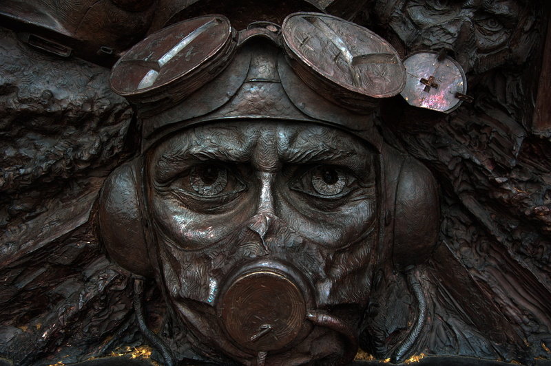 portrait, craft, person, primate, looking at camera, representation, no people, human representation, outdoors, london, sculpture, pilot, aviation, front view