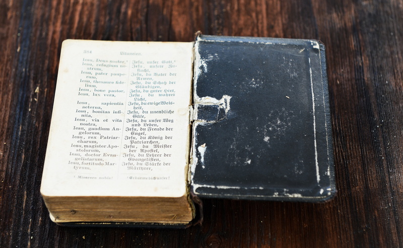 publication, run-down, close-up, text, wood grain, directly above, evidence, no people, communication, paper, open, close, antique, faith, single object