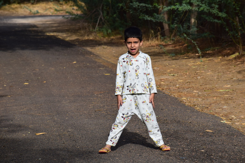 one person, focus on foreground, kid, dream, casual clothing, nature, innocence, person, front view, real people, child, males, childhood, tree, people