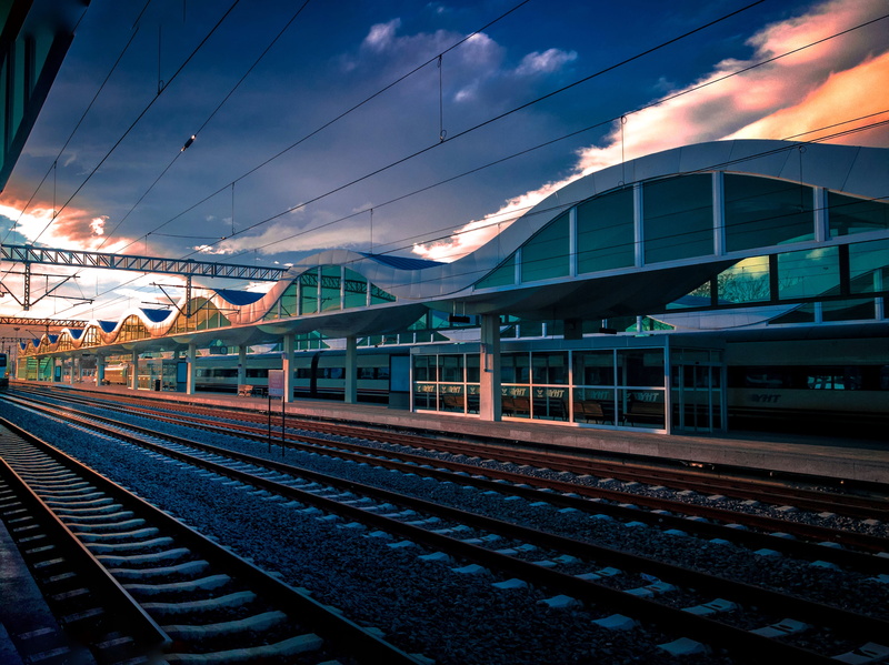 train - vehicle, travel, built structure, cable, railroad station, cloud - sky, railroad track, modern design, public transportation, building, city, perspective