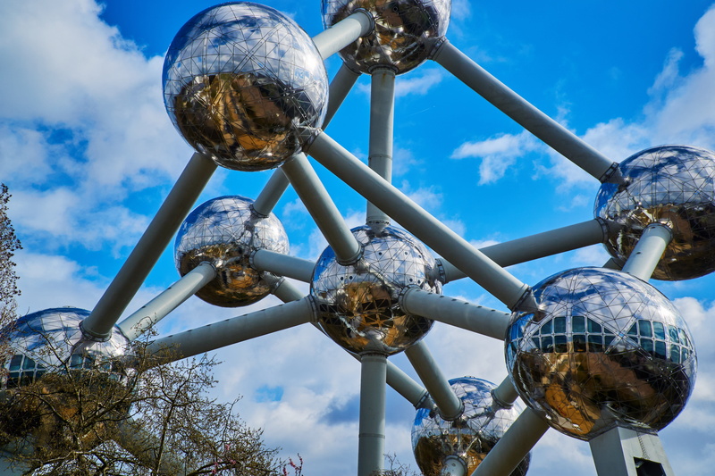 low angle view, tree, belgium, day, sphere, no people, architecture, building, building exterior, outdoors, brussels, blue, tall - high, cloud - sky, city