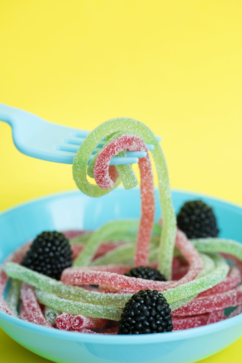 addiction, chewy, chewing, wellbeing, sweet food, background, excessive, food and drink, raspberry, fork, diabetes, colored background, temptation, gummy