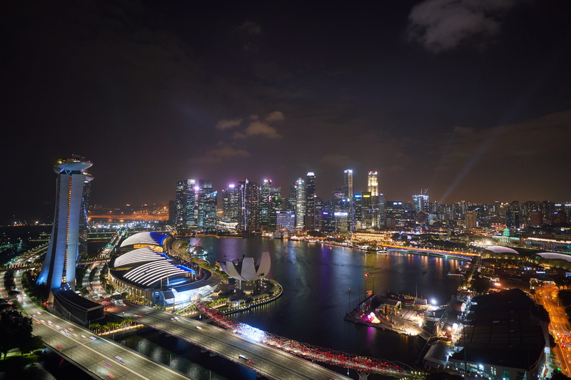 hotel, office building exterior, intersection, cityscape, road, harbor, city, marina, 8K, outdoors, skyscraper, no people, waterfront, building exterior