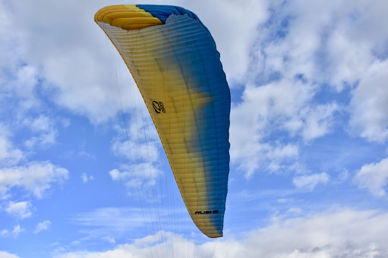 day, balloon, clouds, communication, aircraft, air vehicle, sailing, flying, city, cloud - sky, yellow, wing paragliding, cloudy blue sky, travel destinations
