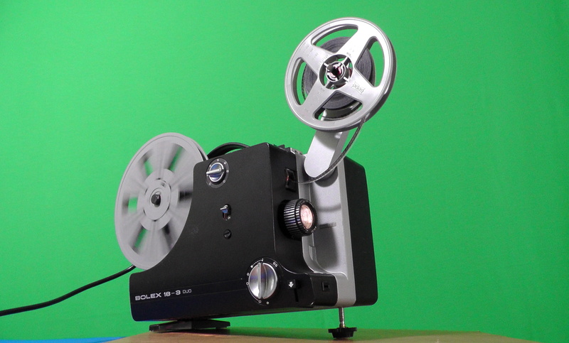 light, technology, home video camera, green background, black, archive, chrome, high angle view, film reel, filming, projector, super8, nostalgia, coil