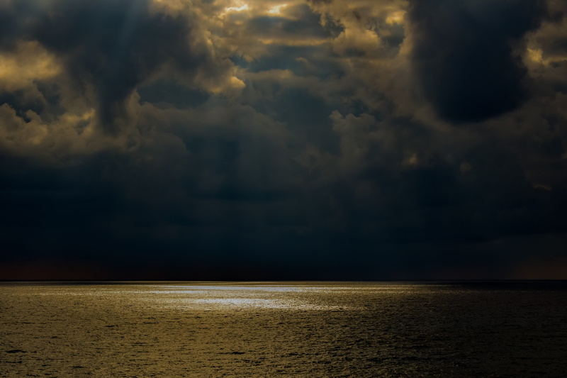sunset, stormy weather, land, beach, tranquil scene, water, scenery, no people, sunlight, overcast, horizon, horizon over water, seascape, dark, dramatic sky