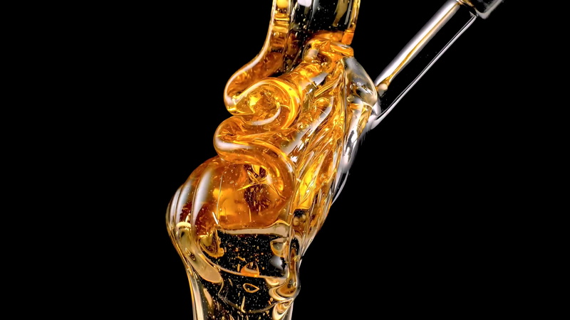 golden, gold colored, single object, liquid, honey, drink, drinking glass, pouring, black background, close-up, glass, gold, studio shot, refreshment, household equipment