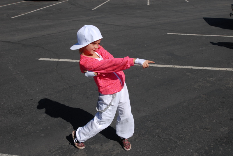 lifestyles, high angle view, real people, hiphop pose, child, cap, anik, street, portrait, road, leisure activity, casual clothing, shadow, clothing, day