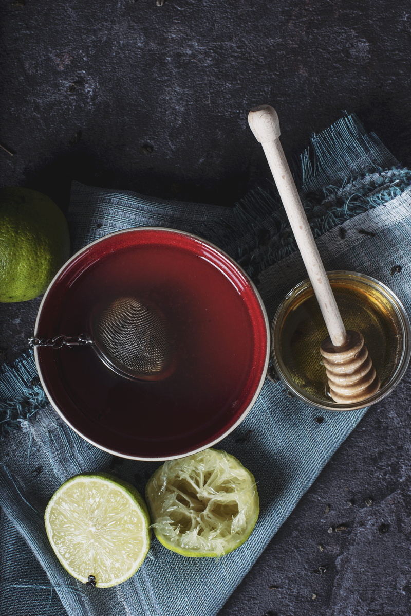 honey, hot drink, container, studio shot, citrus, tea, drink, dipper, no people, bowl, food, red, table, still life, non-alcoholic beverage, lime, fruit