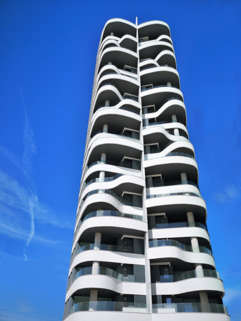 architecture, office building exterior, skyscraper, sunlight, tall - high, nature, low angle view, built structure, arabesque, balcony, outdoors, no people