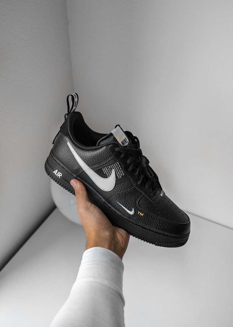 nike, human limb, personal perspective, force, black, personal accessory, one person, close-up, low section, pair, sneaker, hand, limb, holding, white