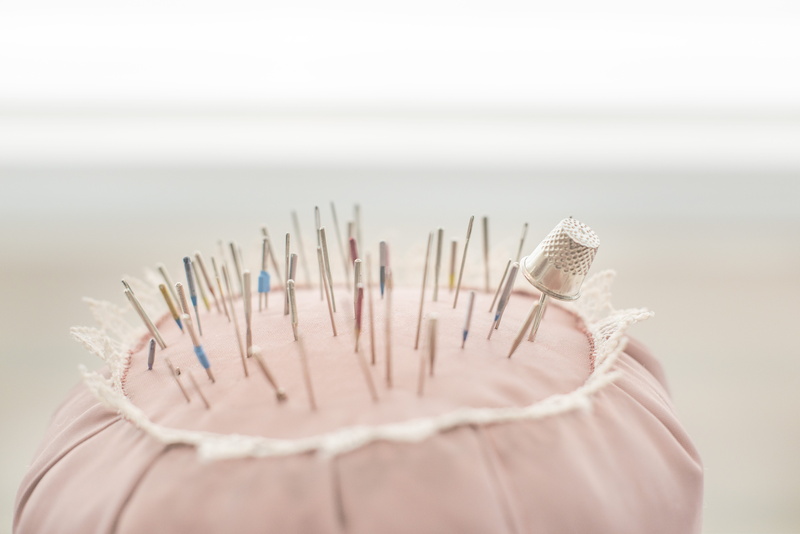 thread, selective focus, focus on foreground, rack, woman, occupation, creative, religion, sewing, equipment, white, indoors, studio shot, white color