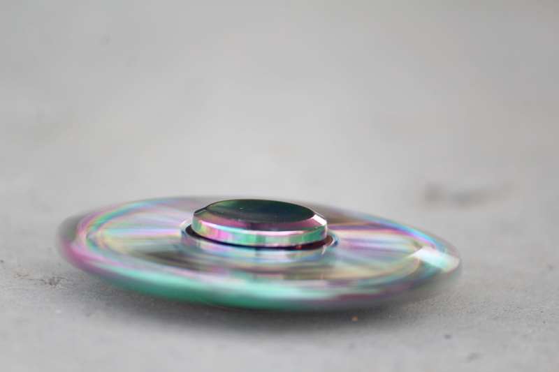 gray background, sphere, simplicity, metal body, refraction, indoors, fragility, Spinner, personal accessory, vulnerability, reflection, still life, luxury