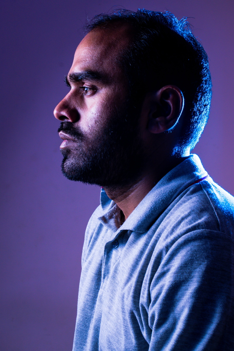 facing, lowkey, blue, 5K, looking away, facial hair, serious, male, depression - sadness, purple neon light, portrait, man, headshot, beard, adult, studio shot