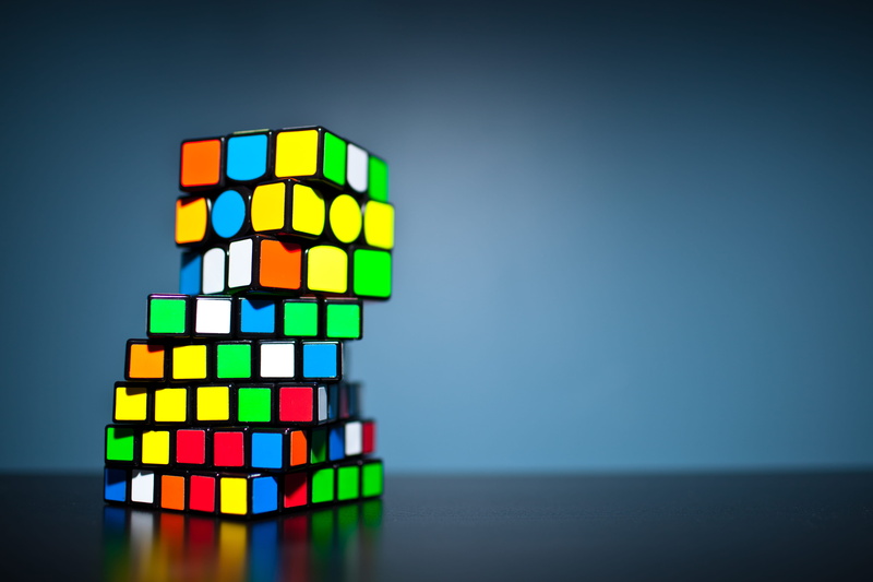 data, copy space, 5K, close-up, toy, colored background, multi, gray background, rubicks, still life, multi colored, illuminated, stack, digital composite