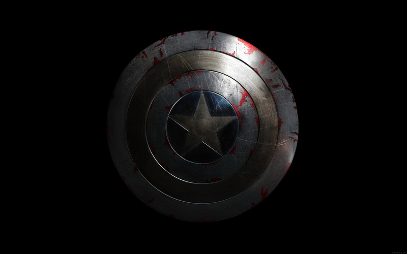glass - material, geometric shape, captain, indoors, black background, close-up, technology, small, america, circle, red, design, black color, studio shot