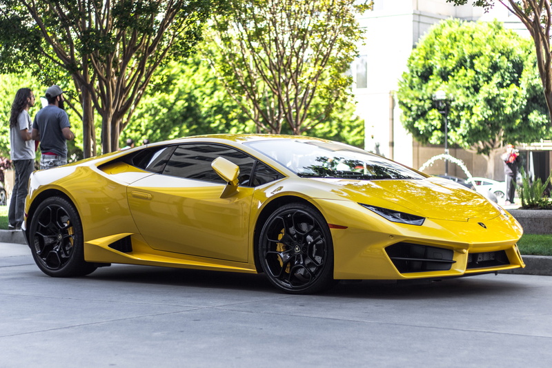 yellow, architecture, speed, outdoors, v10, sports car, men, two, huracan, day, plant, standing, tree, yellow taxi, near, lamborghini, sports, transportation