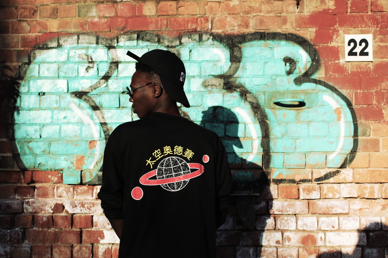 graffiti, mural, painting, symbol, color, art, brick, wall, building, young men, standing, men, lifestyles, young adult, fashion, built structure, red